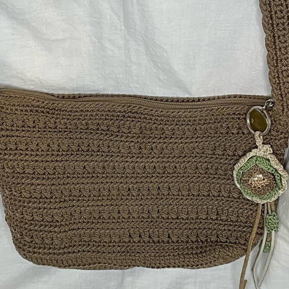 The Sak Crochet Shoulder Bag in Cognac color. Crochet Flower detail on zipper. - Picture 2 of 10